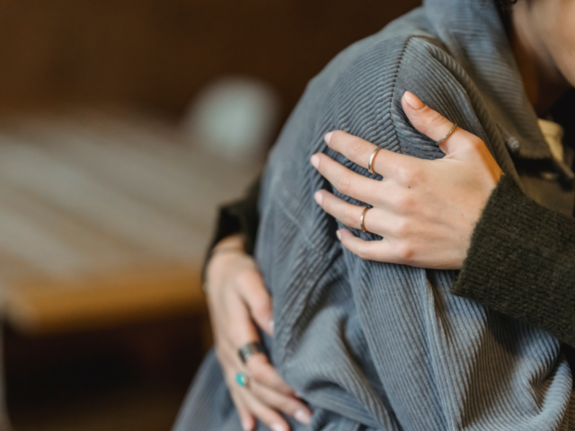 Person holding another person in their arms Crisis Response header